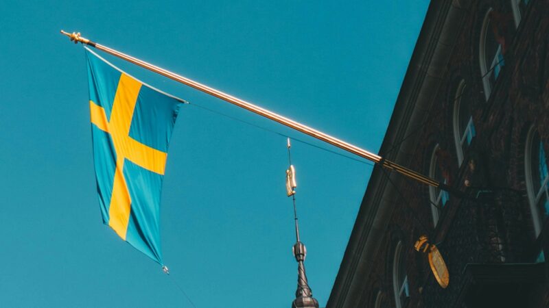 Swedish flag hanging from a building
