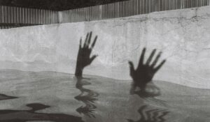 Silhouette of hands just above the waterline