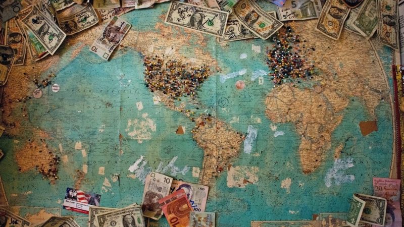 World map with money on it