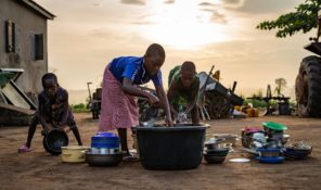 Children in Togo washing dishes