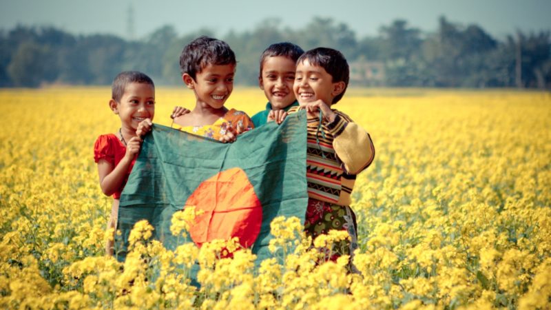 Children holding the flag of Bangladesh