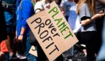"Planet over people" protest sign