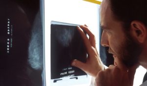 Man looking at x-ray