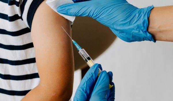 Child injected with vaccine