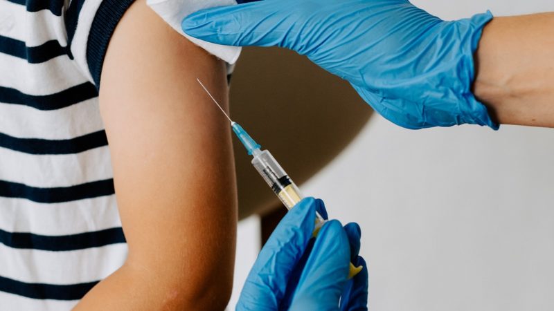 Child injected with vaccine
