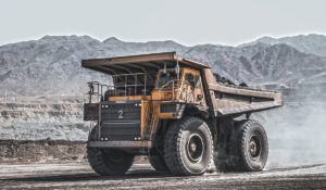 Mining dump truck in arid landscape