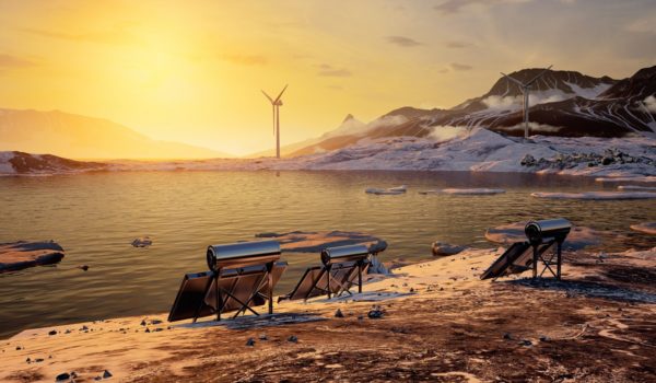 Mountain lake with wind turbines and solar panels