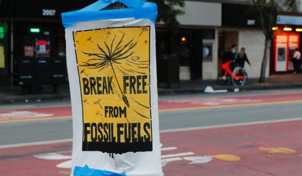 "Break free from fossil fuels" sign