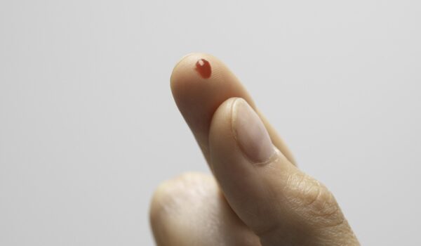 Spot of blood on tip of finger