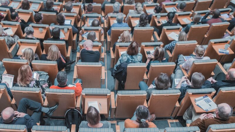 People in auditorium seating