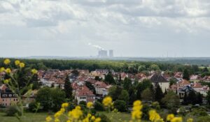 Small German town with polluting coal plant in the distance