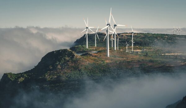 Wind turbines amid clouds