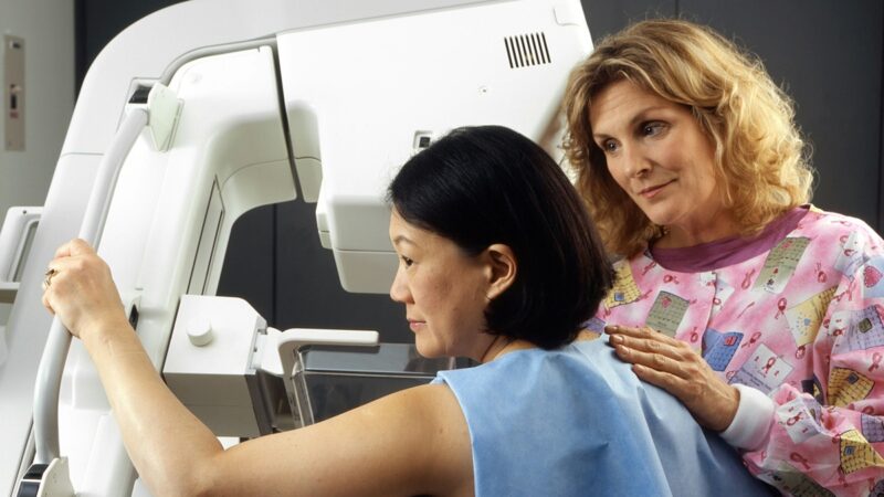 Woman receiving mammogram